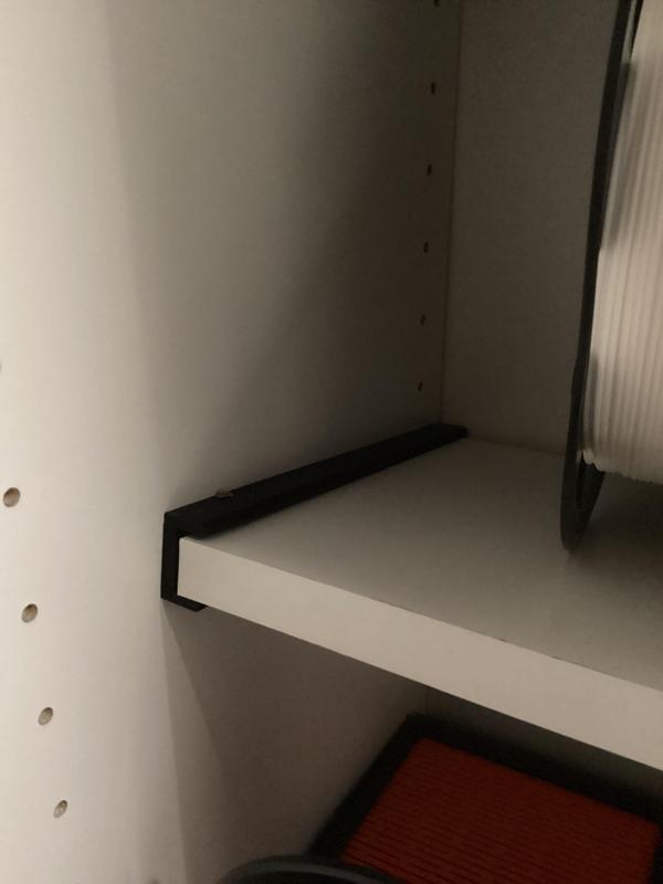 Holder for attaching a laminate board