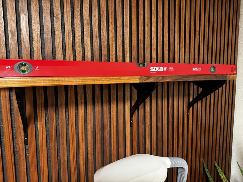 Shelf bracket for wood slat wall