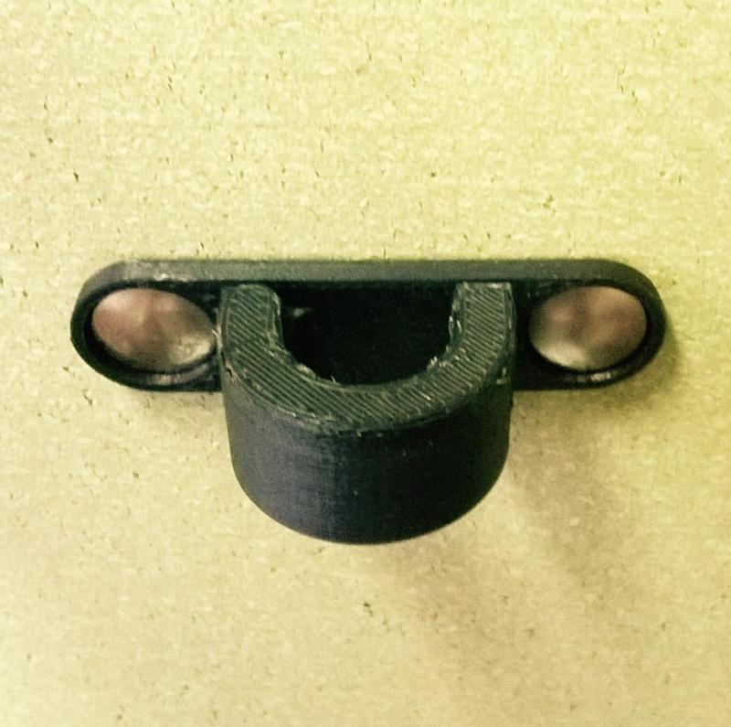 Desk mountable hinged cable holder