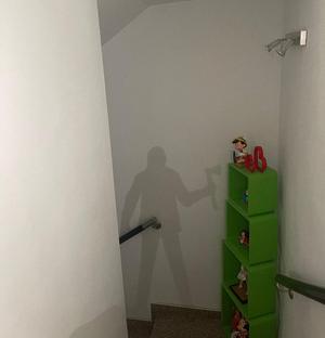 Silhouette of a man with an ax on a base