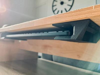 Keyboard storage under desk