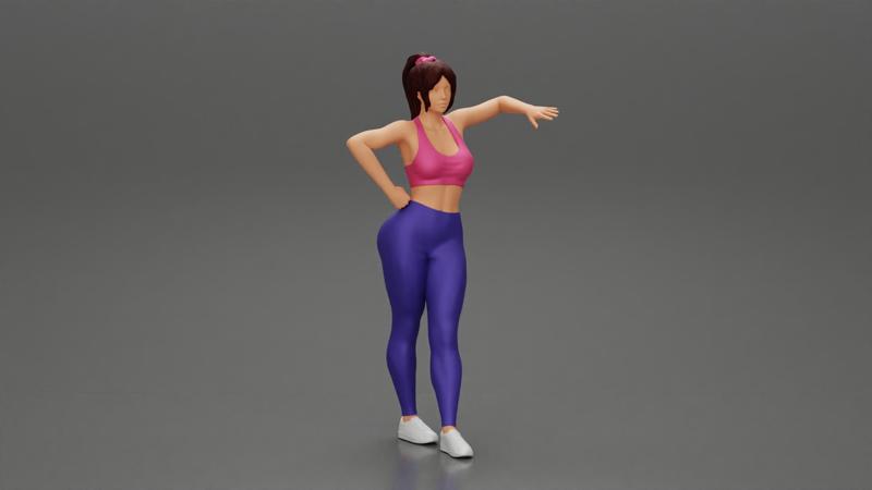 Sexy fitness girl leaning on a wall while standing outdoors