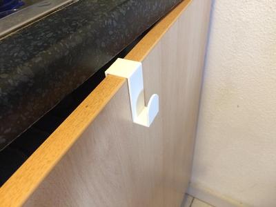 Towel holder for cupboard door