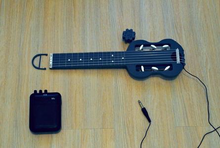 Mini electric guitar for travel.