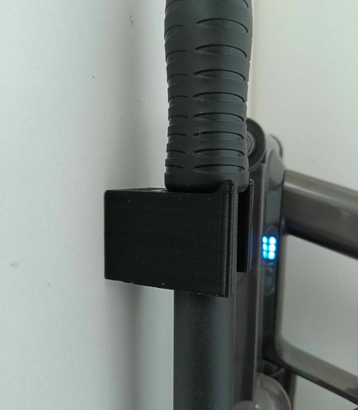 2 wall-mounted broom handle holders