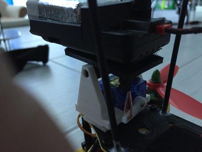 Extremly compact tilt camera holder