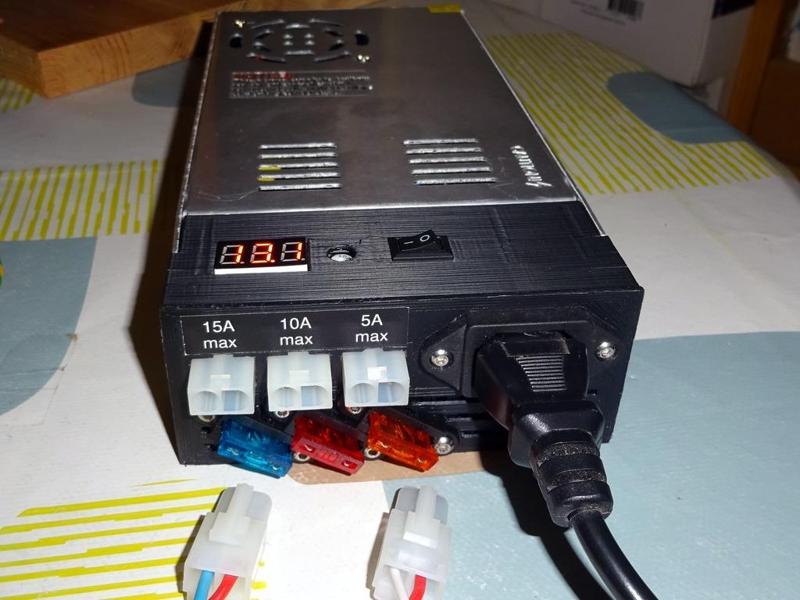 Power supply cover with fused outlets