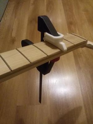 Nozzle-press for guitar frets