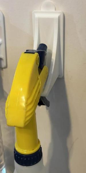 Adhesive Strip Spray Bottle Hanger   