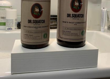 Shampoo and conditioner bottle stand