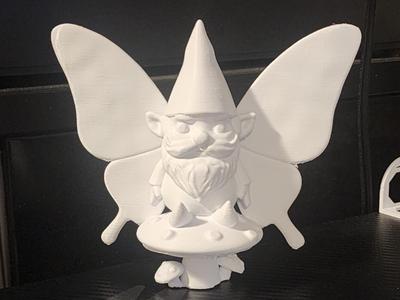 Garden Gnome Butterfly Sitting on a Mushroom