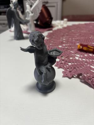 Baby angel with wings sculpture