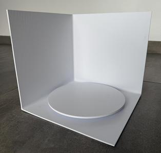 Photo box with rotating tray on bearings.
