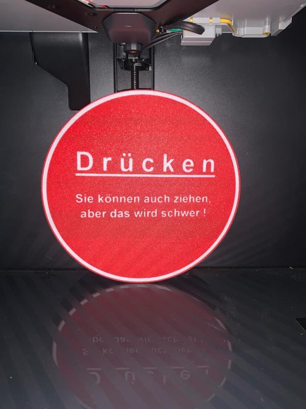 Lustiges Schild: Drücken...