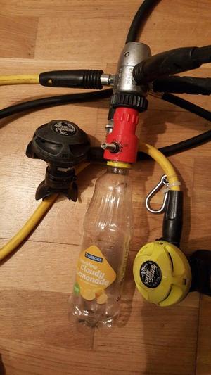 Soda bottle to scuba DIN first stage attachment valve