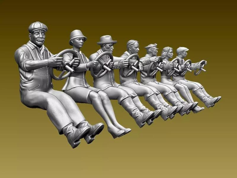 drivers group of figurines on steering wheel