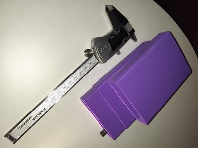 Caliper box in 2 parts