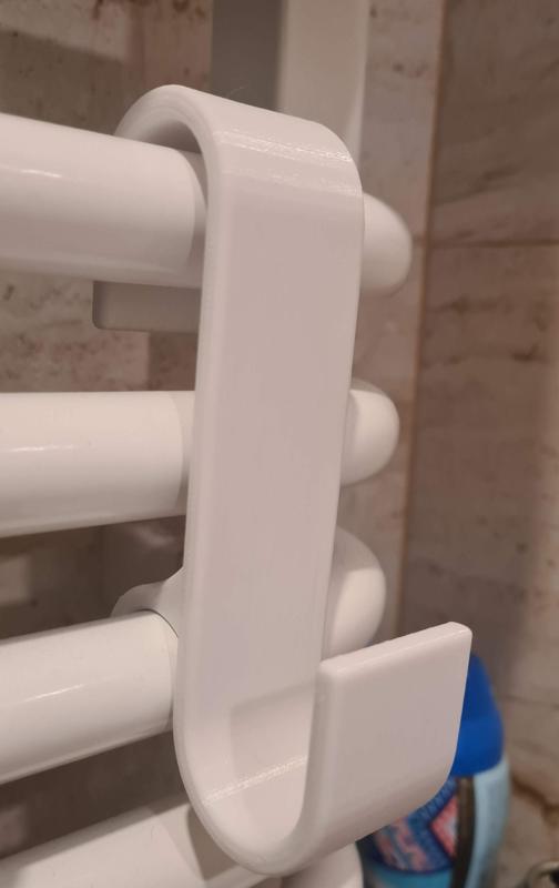 Hanger for a bathroom radiator