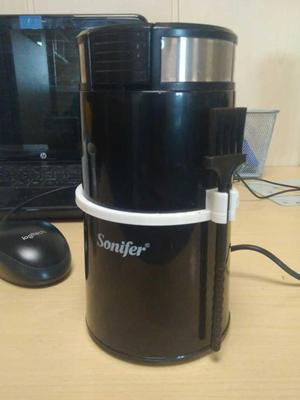 Coffee grinder brush holder