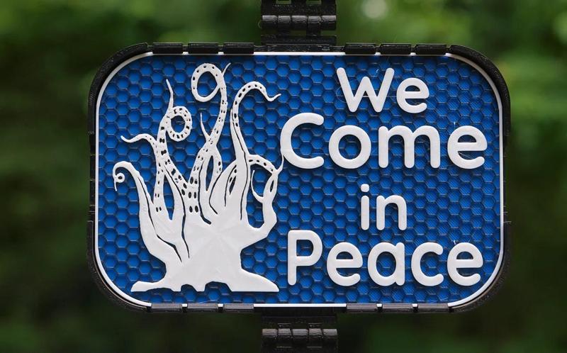 We Come in Peace sign   