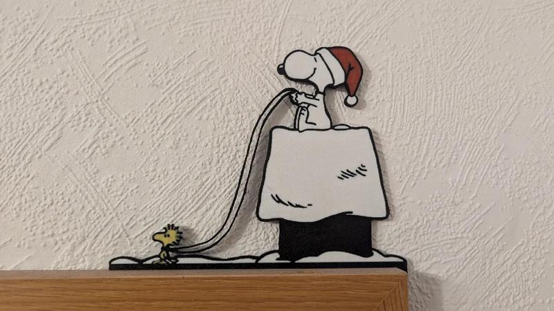 Türrahmenbild Snoopy in Weihnachtskutsche   