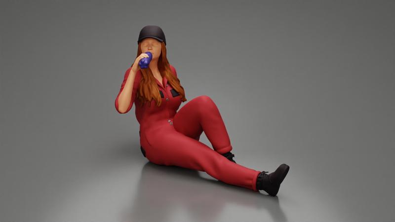 Tired woman mechanic in suit and cap sitting and drinking water during from bottle