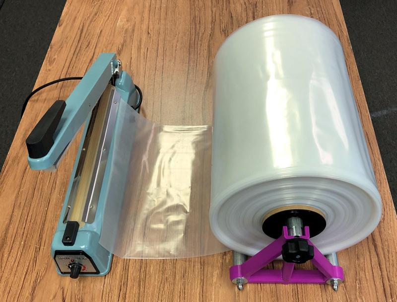 Stand to hold a 10Kg roll of heat/vacuum-seal bag material and/or spools of wire