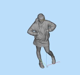 Miniature female figure holding a backpack with both hands