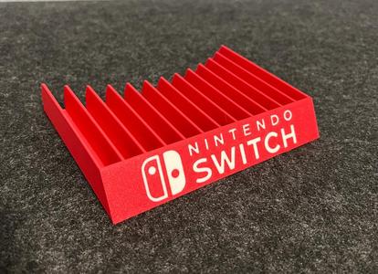 Nintendo Switch game holder with embedded logo   