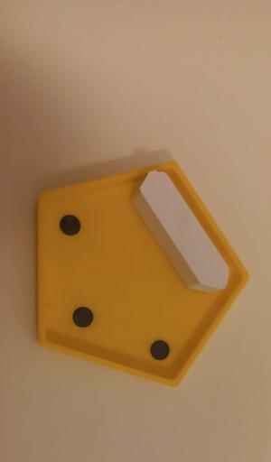 A magnetic fidget that slides on the pentagon