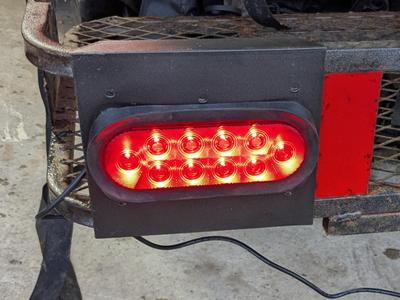 Trailer hitch cargo carrier light mount.