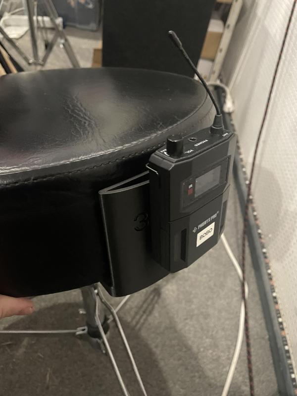 In ear holder for drum throne