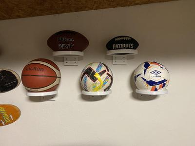 American football ball wall holder