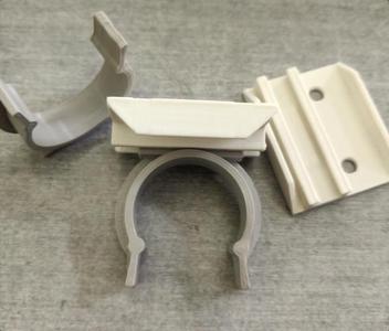 Hook-clip for kitchen cabinet baseboard
