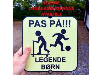 Playing kids warning sign for road