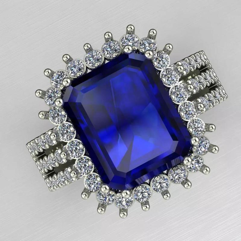 Blue Emerald cut stone with micro halo diamond