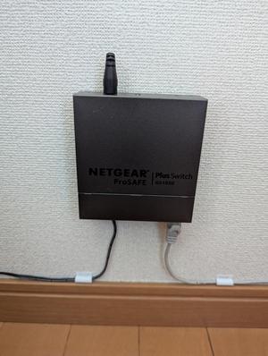 Staple-on wall mount for the Netgear GS105E