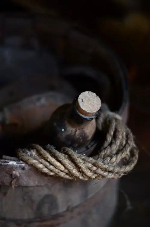 Vase blackberries on wooden table
