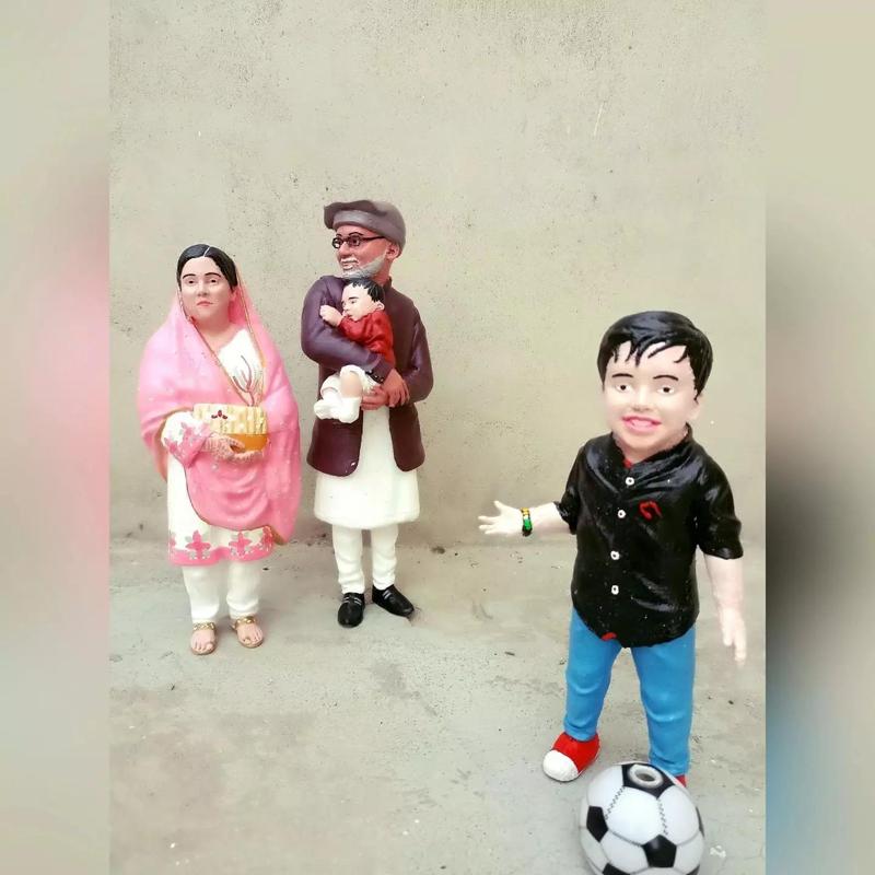 Family figurines of narendra modi and his