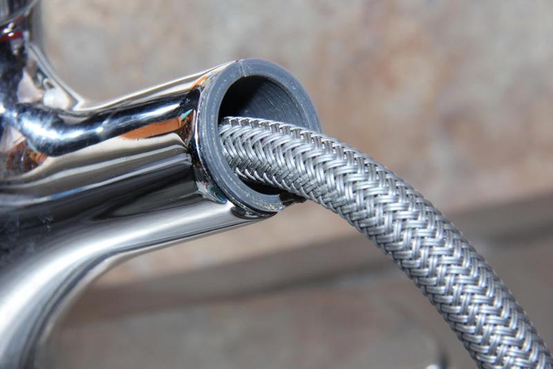 Kitchen pull-out faucet insert bushing