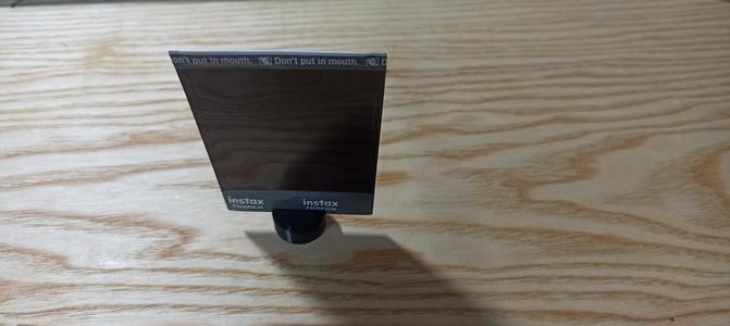 Stand for a photo for a polaroid camera