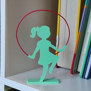 Little girl jumping over Filament rope