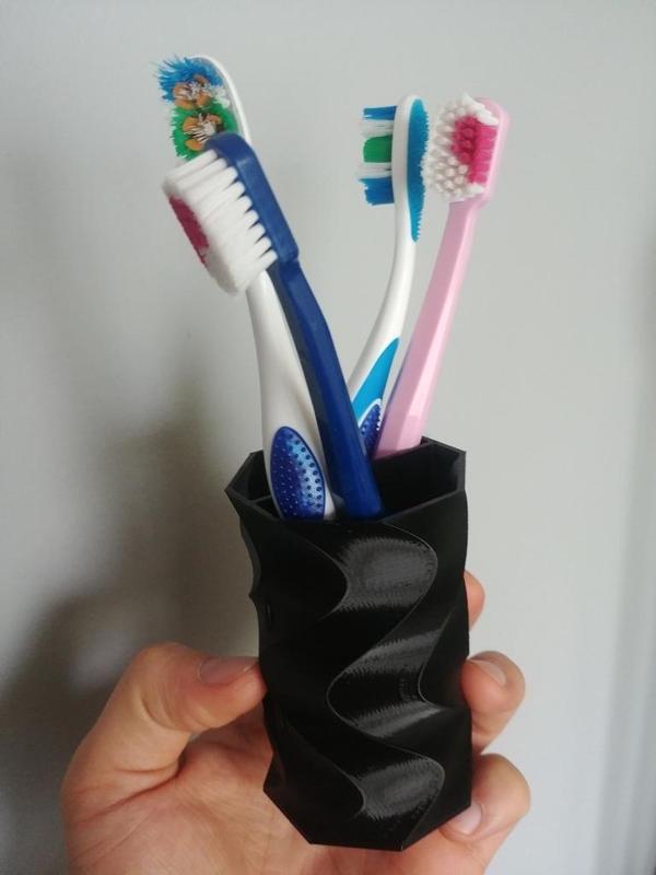 Twisted cup for penscils or toothbrushes
