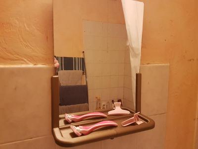 Stand for simple dirty bathroom mirror