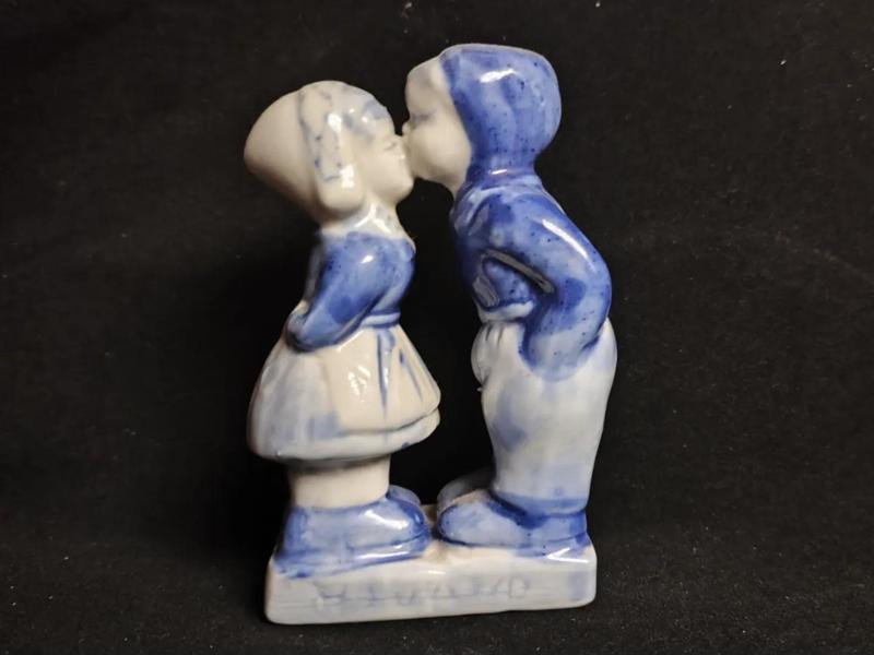 A ceramic kissing figurine, a love token from a bygone era, a tribute to my parents' love