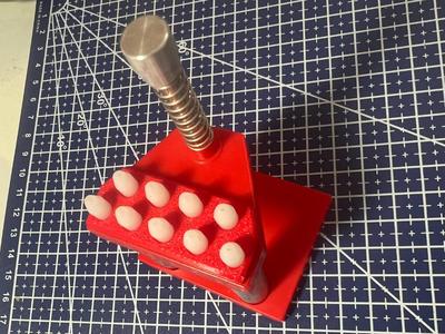 Needle press tip organizer for watch hands