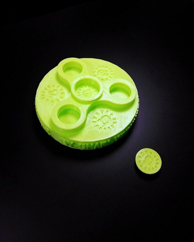 The Penny Fidget Top Spinner with Arena-Dock (use 10-12in's of string for spinning spinner)