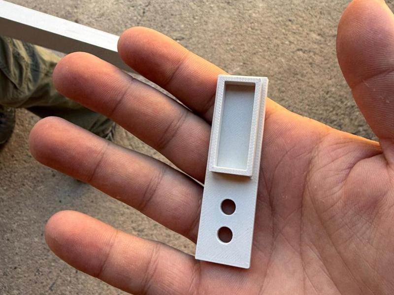 Tubular anchoring plate