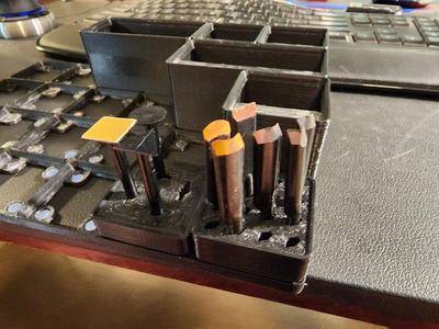 Gridfinity Microlux chisel tip and sander head storage modules