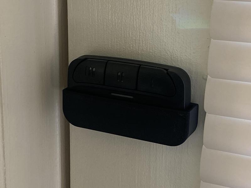 Wall or door mounted pocket for garage door remote controller